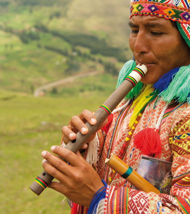 Playing a traditional bamboo flute PHOTOGRAPHER RALPH LEE HOPKINSGETTY - photo 6