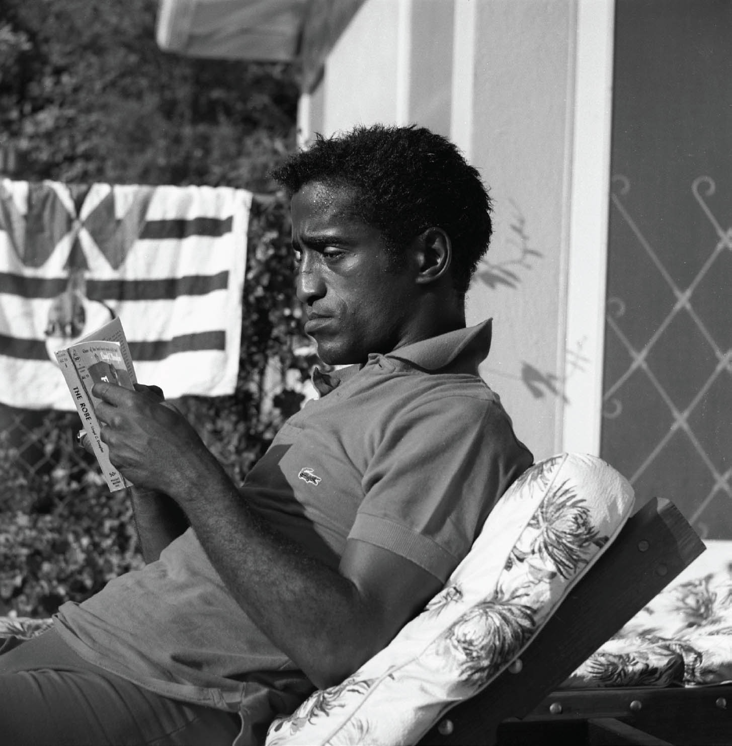 For his reading pleasure sammy davis jr lounges with a paperback edition of - photo 7