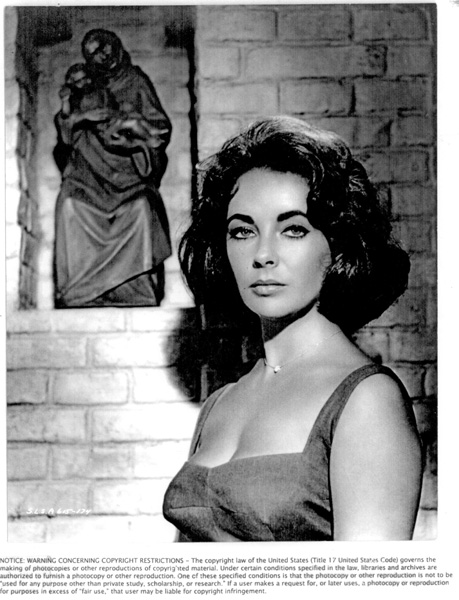 7 While filming Suddenly Last Summer Taylor stands near a symbol of the - photo 7