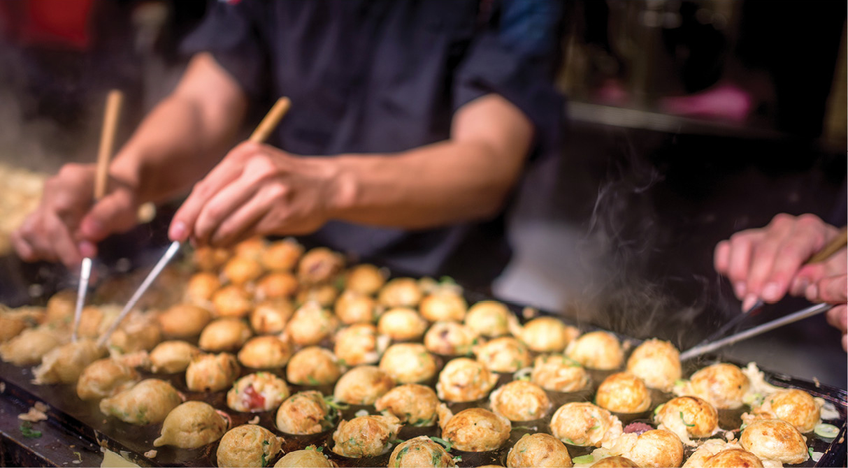 Cooking takoyaki a popular ball-shaped savory snack in Japan Stalls in - photo 16