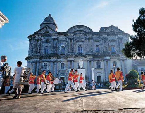 Civic parade passing the heavyset Basilica of Taal Batangas Surfboards - photo 7