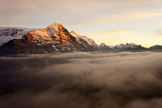 The Eiger floats on a sea of mist as dusk settles over the Grindelwald basin - photo 12