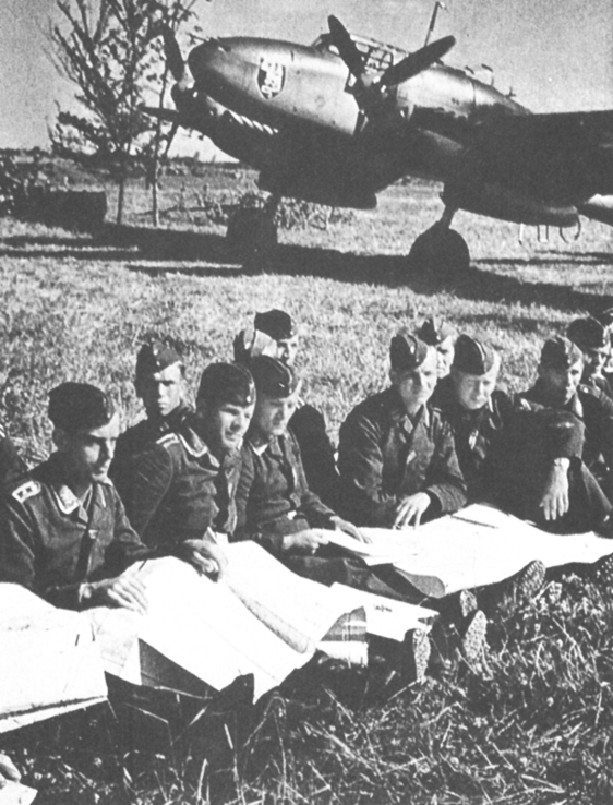 Messerschmitt 110 crews at an outdoor briefing Messerschmitt 109s in finger - photo 31