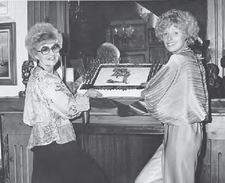 Elayne Lindberg her daughter Bonnie and the sheet cake baked for the opening - photo 6