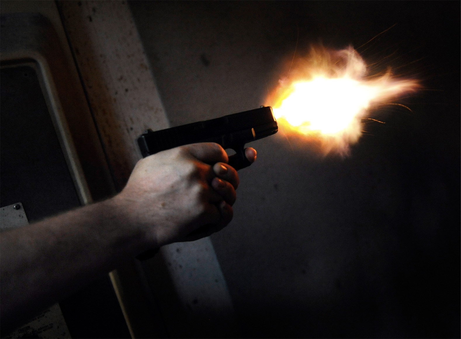 A Glock 9mm semi-automatic pistol is fired in the shooting range at Bobs Guns - photo 3