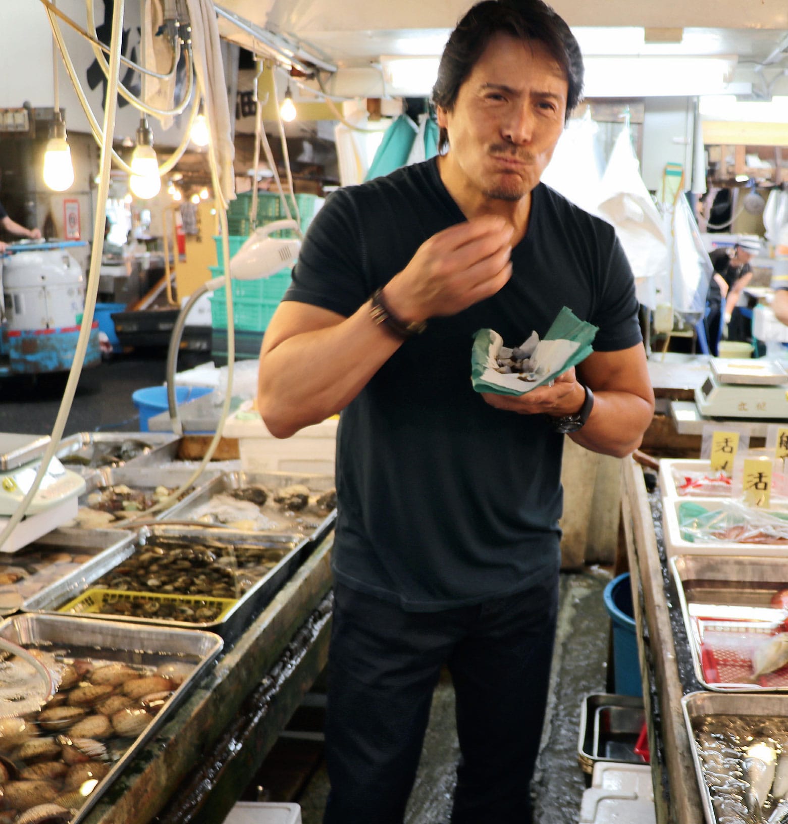 The author enjoying a fresh bite at the Tsukiji Fish Market in Tokyo Japan - photo 3