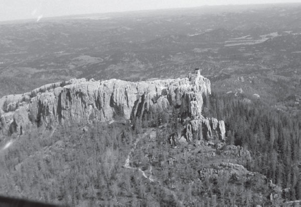 Black Elk Peak capped with a stone fire lookout tower stands prominently as - photo 3