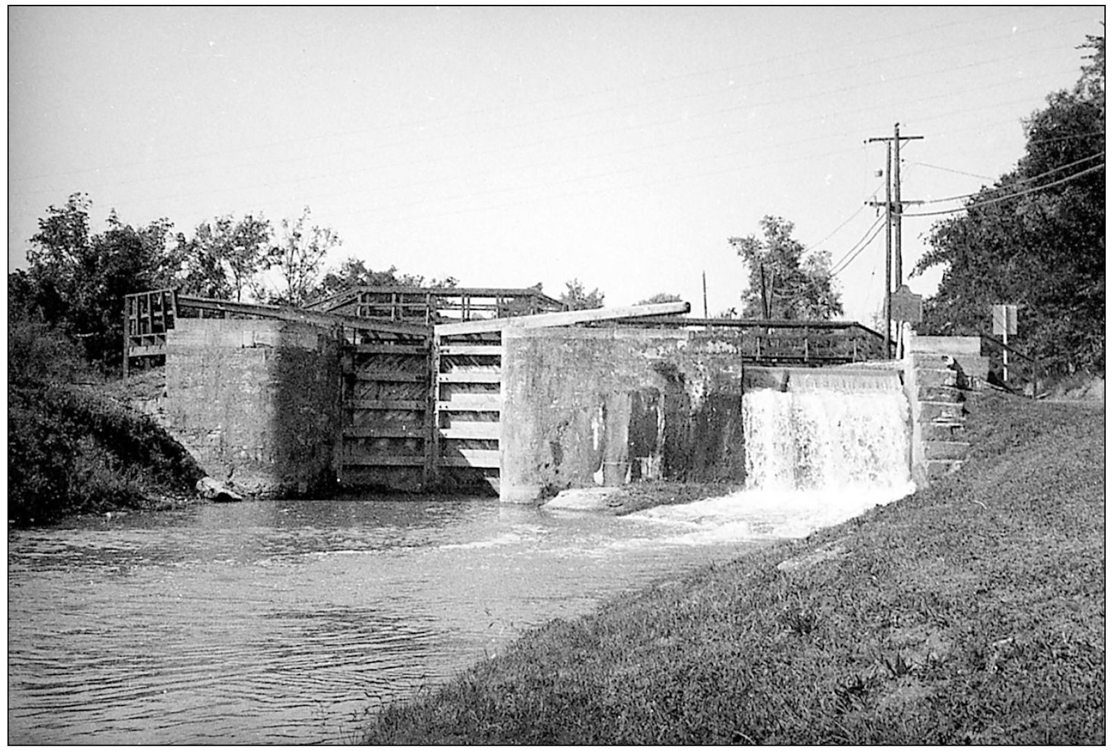 Although the lock is closed for boat traffic the canal continues to flow from - photo 9