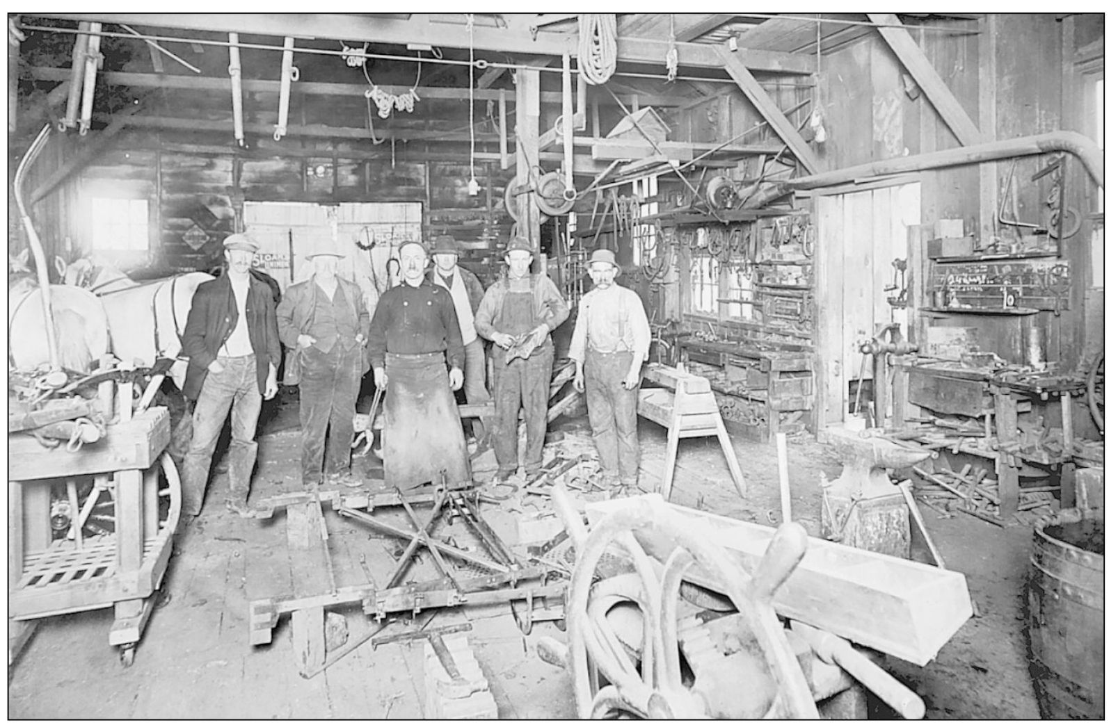 CRUICKSHANKS BLACKSMITH SHOP William Cruickshank pictured center opened a - photo 9