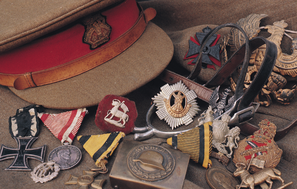 A broad-spectrum layout of military insignia awards and headdress including a - photo 2