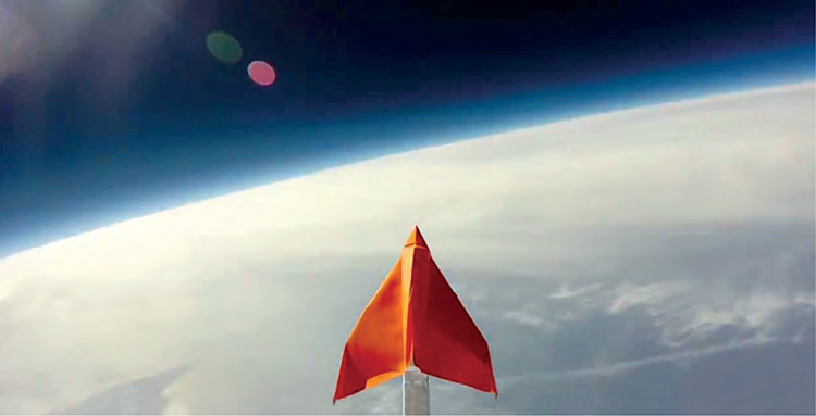 One of my paper airplanes mounted on a boom suspended below a weather balloon - photo 2