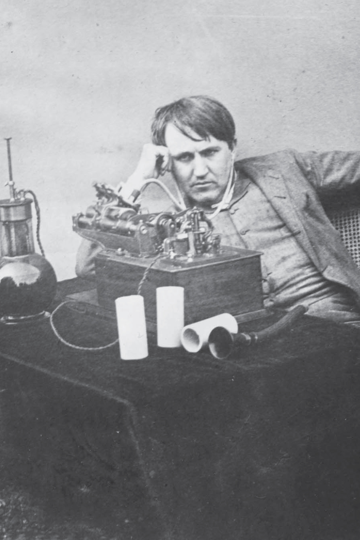 Thomas Edison listening to a wax cylinder phonograph at the Edison laboratory - photo 3