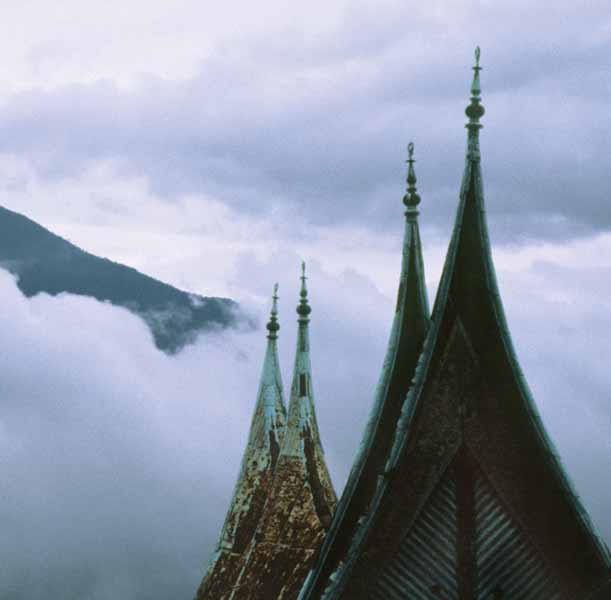 The roof of a traditional Minangkabau house with cloud-wrapped Singgalang - photo 11