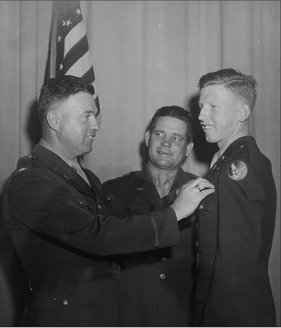 Second Lieutenant David W MacArthur receiving his wings from his father - photo 6