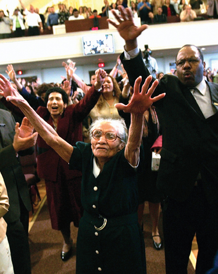 Members of The Bay Ridge Christian Center Pentecostal Church pray during a - photo 23