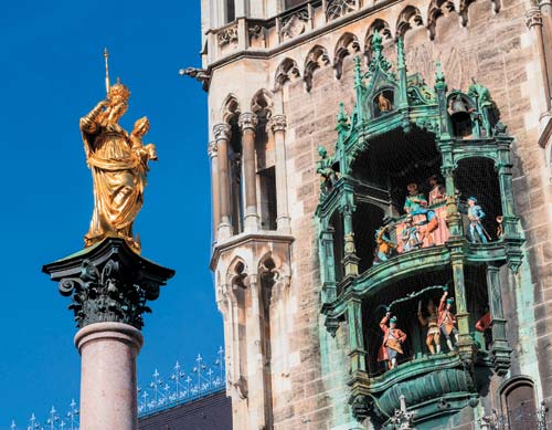 A statue of Mary and an ornate glockenspiel with daily shows overlook - photo 17