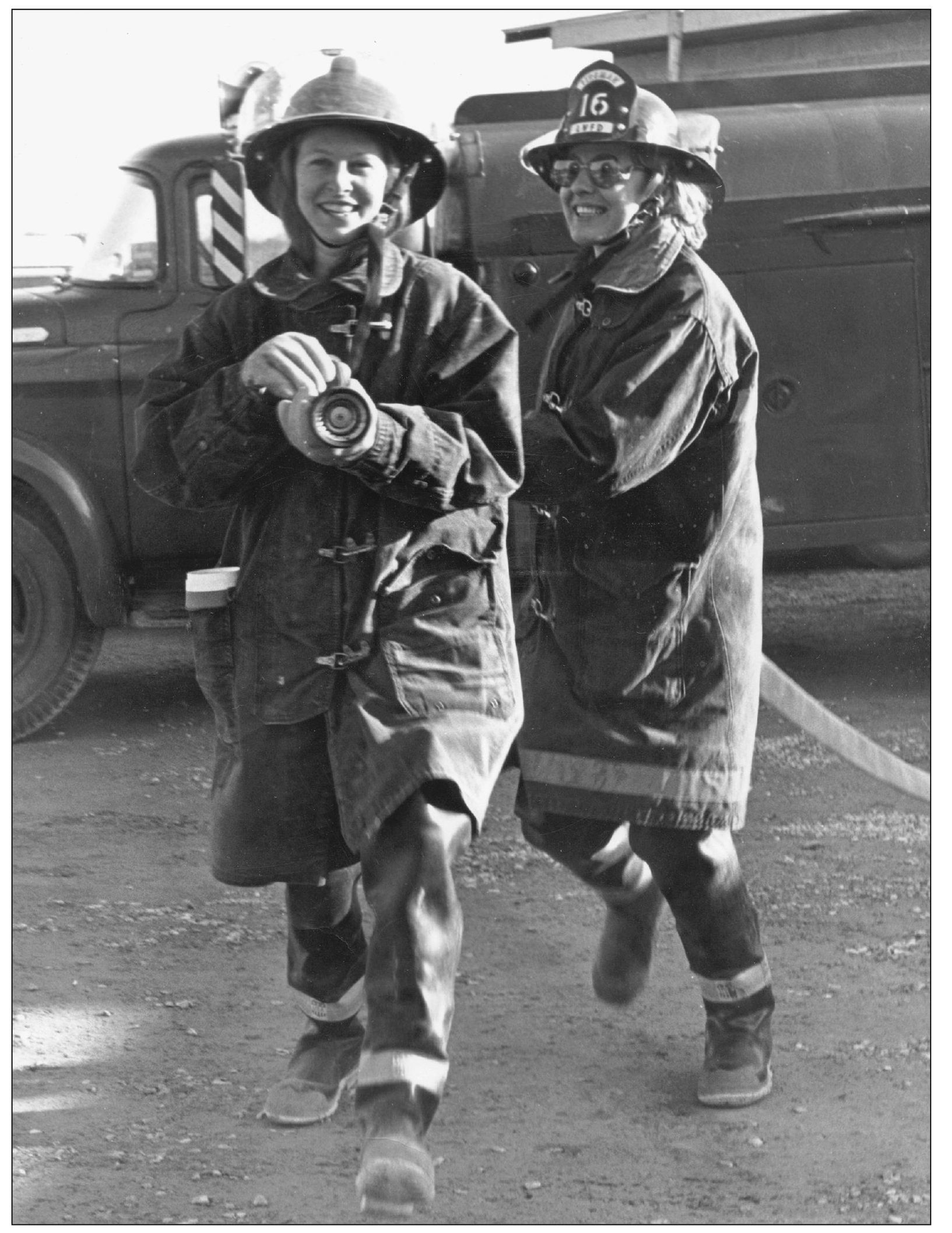 HOT GIRLS Two volunteer firefighters participate in a training session at - photo 13