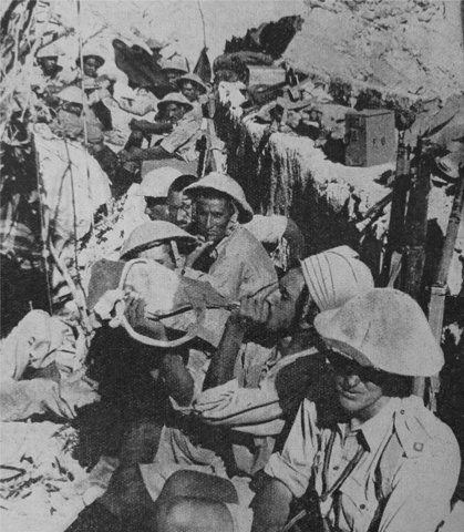 12 Indian troops resting at a signal point in a fort overlooking Mount Sanchil - photo 13