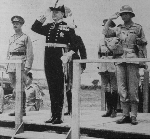 2 The governor of Kenya Sir Henry Moore takes the salute as South African - photo 3