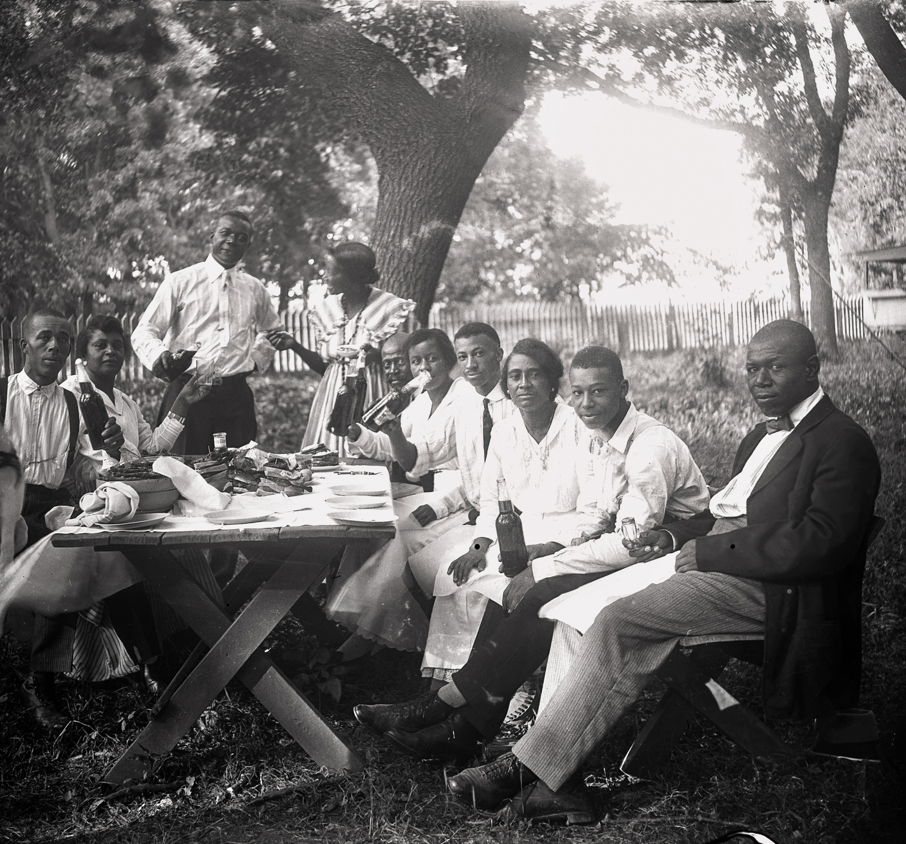 Picnickers enjoy a sunny afternoon in a Lincoln Nebraska backyard - photo 10