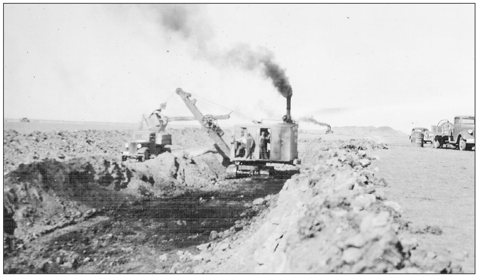 Smoke rises from the engines of machinery used to construct Canal No Three - photo 13