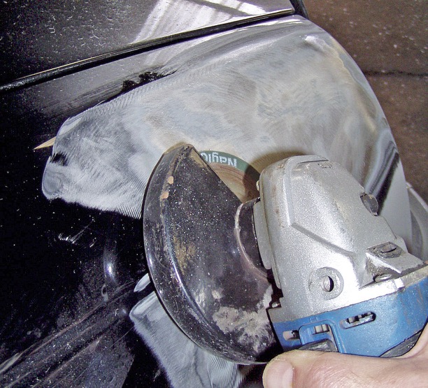 Grinder employed to remove paint using an 80 grit disc and flexible backing - photo 11