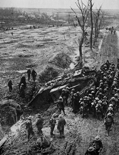 British troops gather around their supporting tank it was designed to cross - photo 2