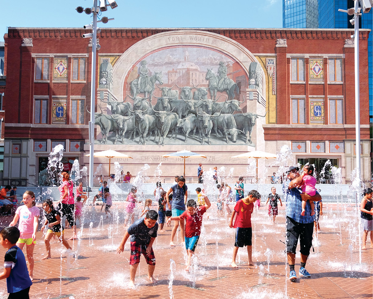 Kids play in the sprinklers on Sundance Square Plaza with the Chisolm Trail - photo 19