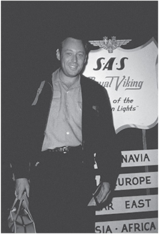 Leon Uris in Copenhagen in fr ont of an SAS sign as he transfers planes en - photo 1