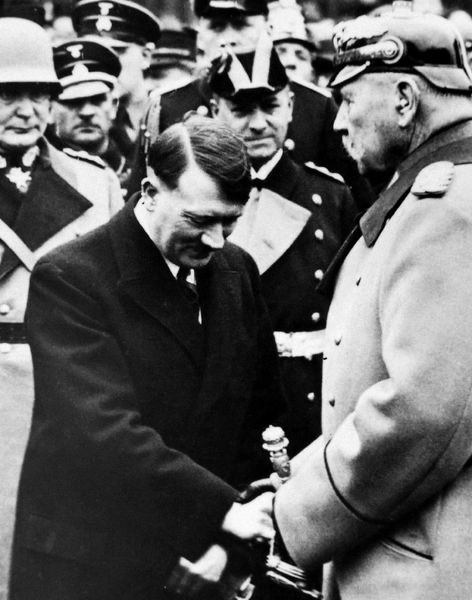 Adolf Hitler as Chancellor bows to President von Hindenburg at a memorial - photo 5