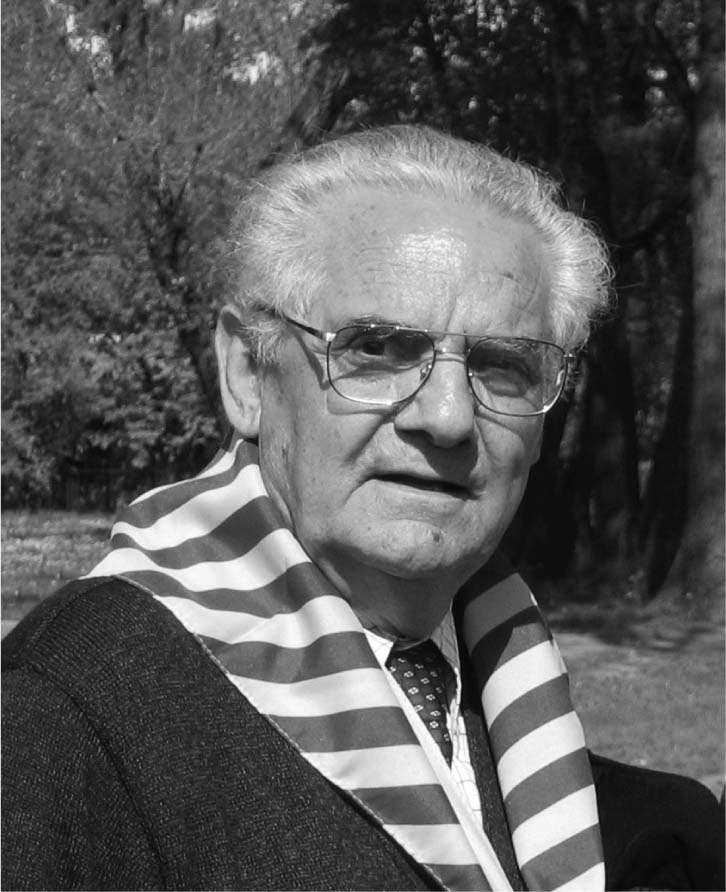 Portrait of Shlomo at Auschwitz wearing the blue and white scarf of former - photo 2