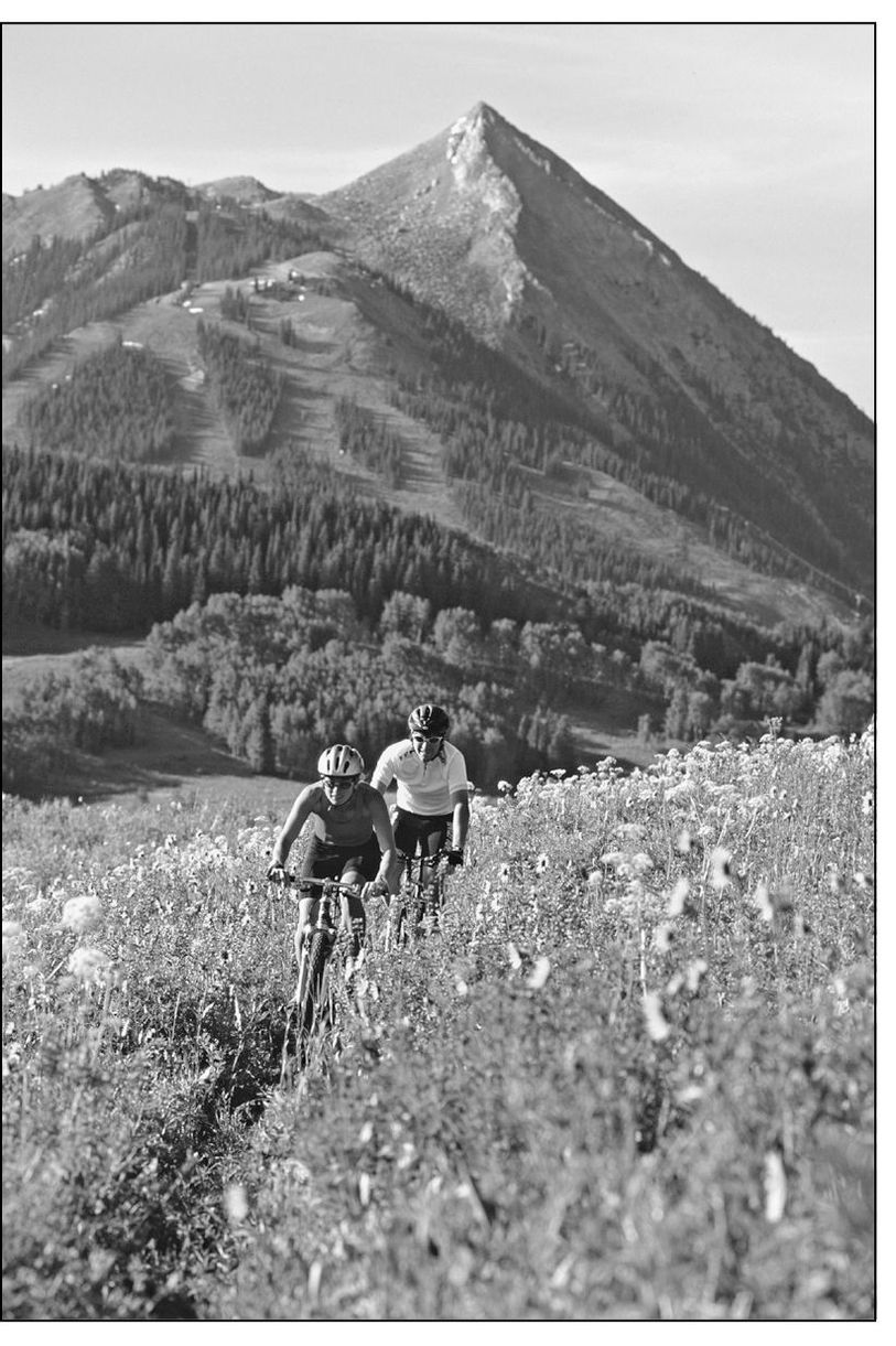 SNODGRASS SPLENDOR Two mountain bikers pedal uphill on a beautiful trail on - photo 6