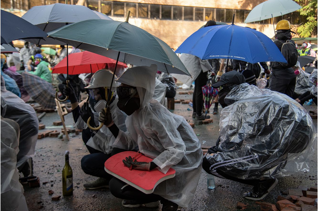 Protesters at Hong Kong Polytechnic University brace for impact from tear gas - photo 9