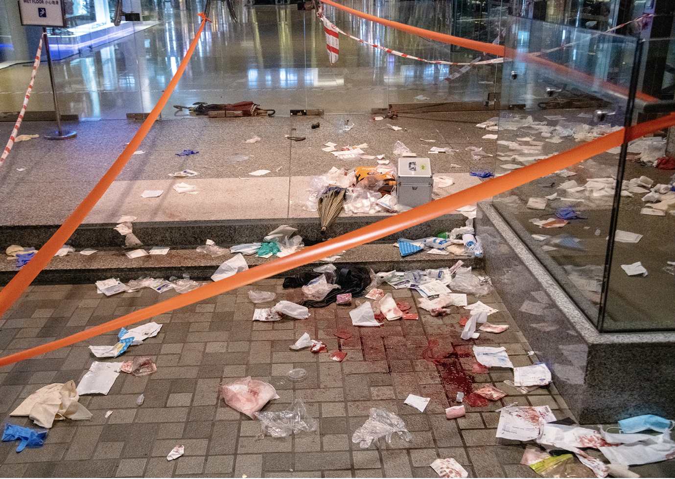 A crime scene at Cityplaza Mall in the Tai Koo District has been taped off by - photo 17