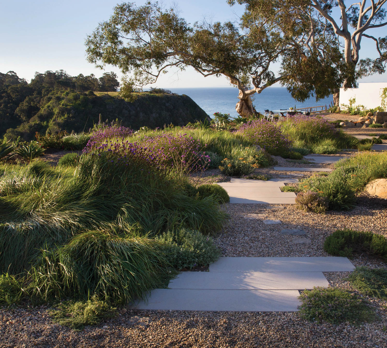 Broad concrete pavers lead to the entertaining area and draw the eye tothe - photo 13