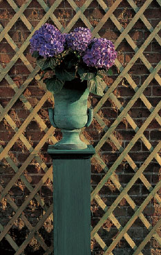 A hand-thrown urn painted dark green has patinated to a mottled bronze color - photo 10