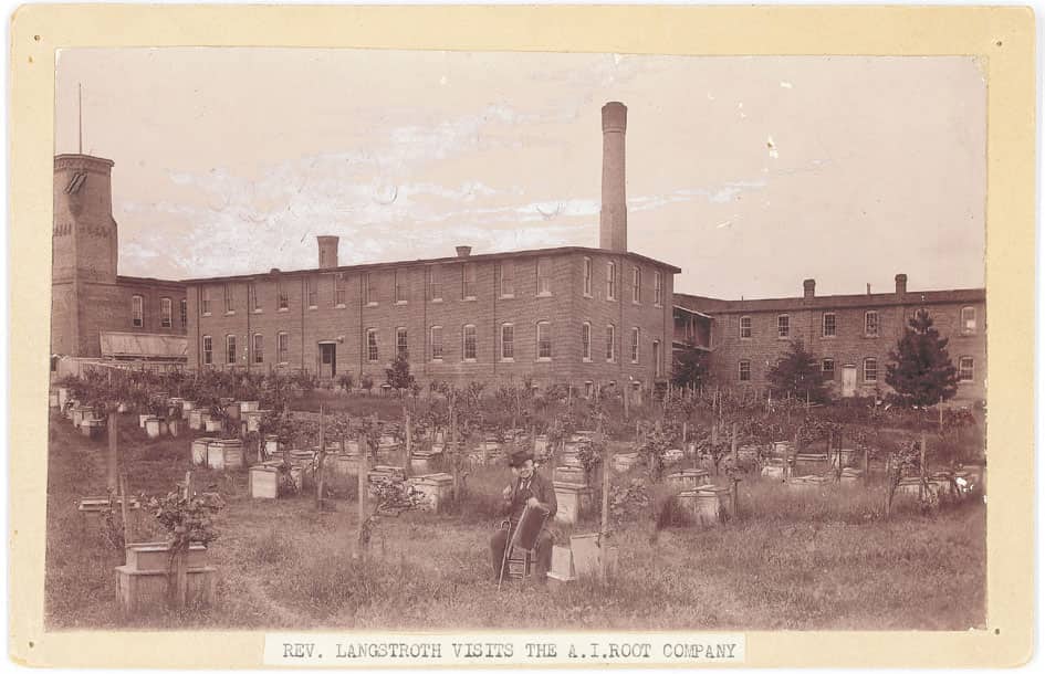 L L Langstroth holding the frame he invented sitting in the beeyard at the - photo 5