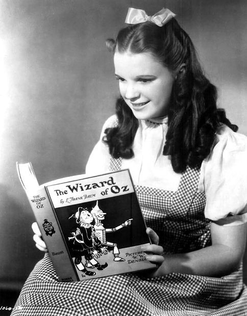 Judy Garland as Dorothy Gale reading The Wizard of Oz Publicity still - photo 20