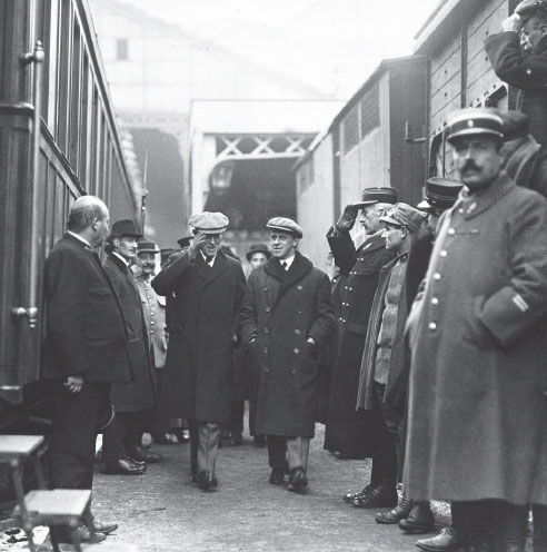 President Woodrow Wilson and George Creel in step as they stride a train - photo 1