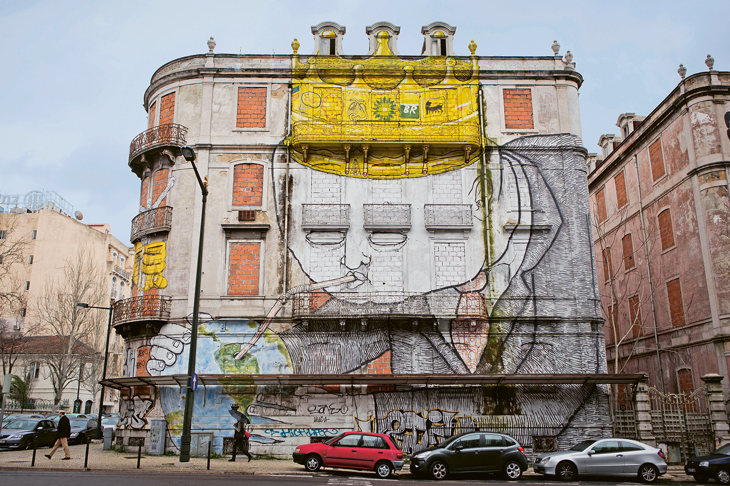 A Street art in Lisbon Portugal by artists Blu and Os Gmeos showing a - photo 7