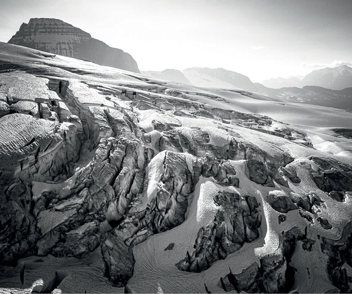 Soft sunlight highlights a maze of crevasses on Mount King Edward in the - photo 4