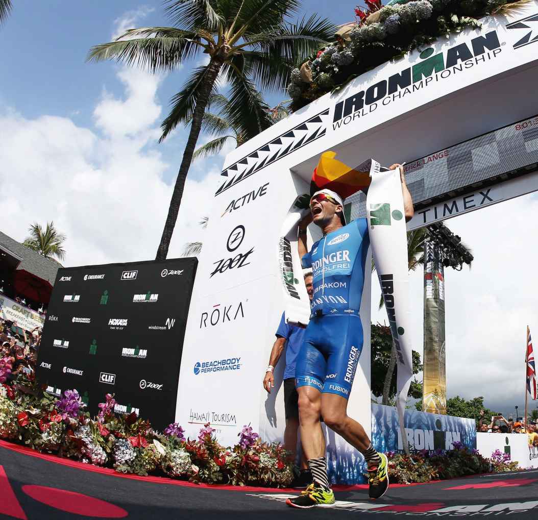 Patrick Lange celebrates becoming the 2017 IRONMAN World Champion breaking the - photo 3