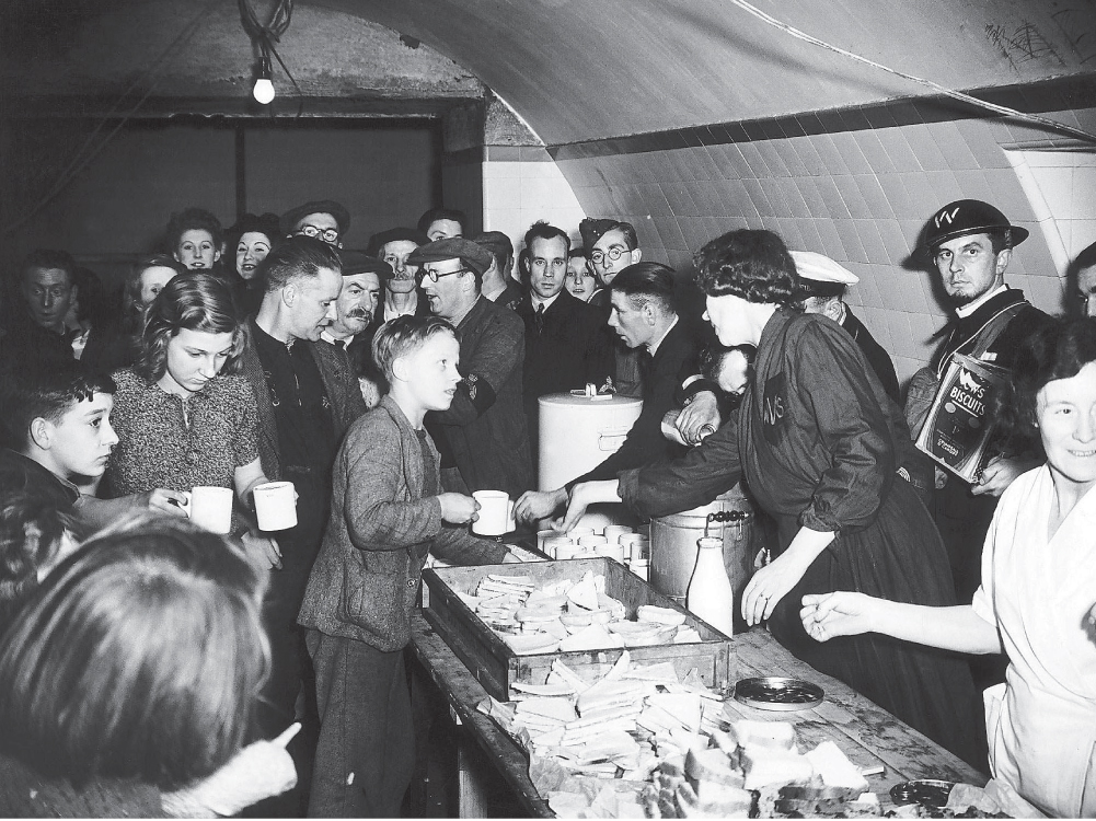 13 October 1940 The Womens Voluntary Service serve tea and sandwiches to - photo 11