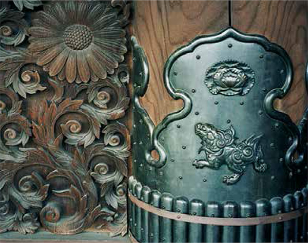 The wood carving on the bottom of the door as well as the metalwork which - photo 10