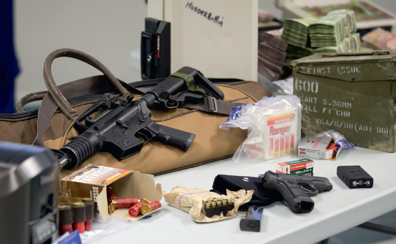 Millions of dollars and firearms found by detectives in Operation Genoa - photo 15