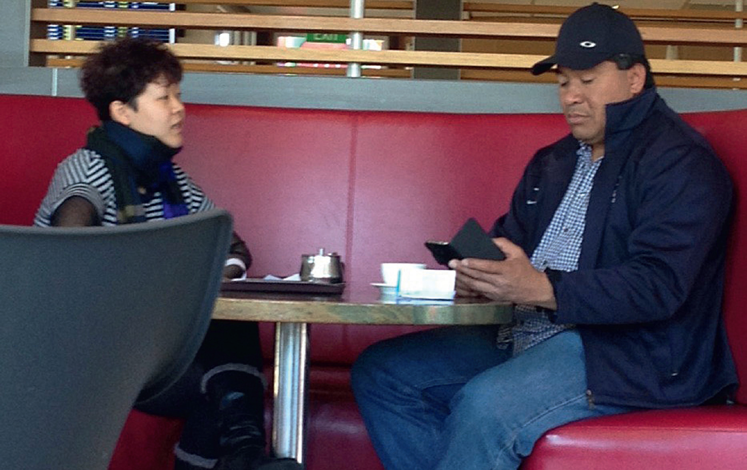 A meeting at a McDonalds restaurant between Yixin Gan left and Mosese Uele - photo 19