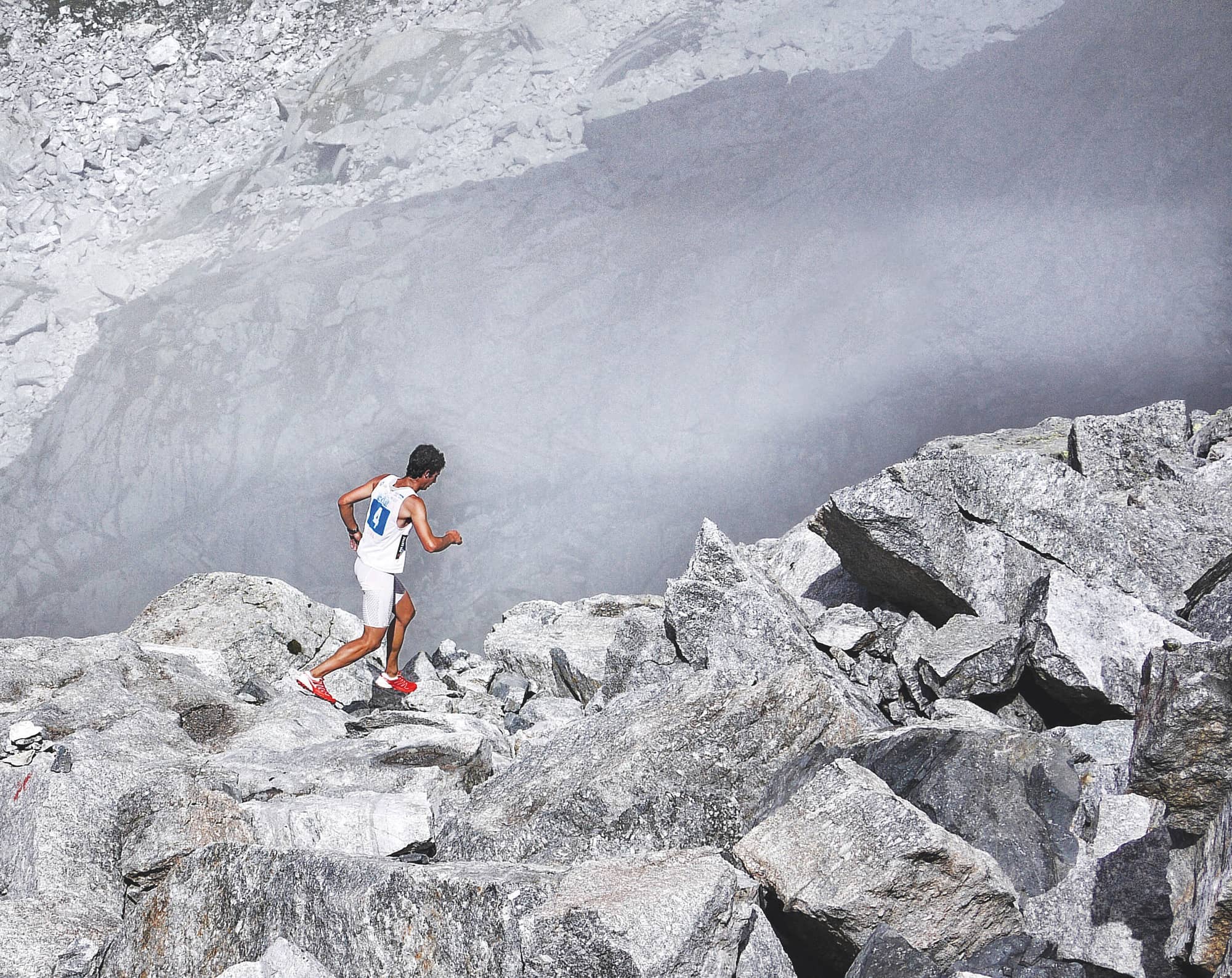 Kilian Jornet runs in the sky across one of the many technical ridges at the - photo 6