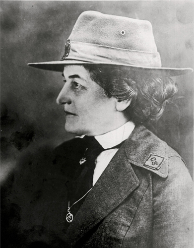 Juliette Low in uniform wearing the Thanks Badge 1920s Girl Scouts on the - photo 6