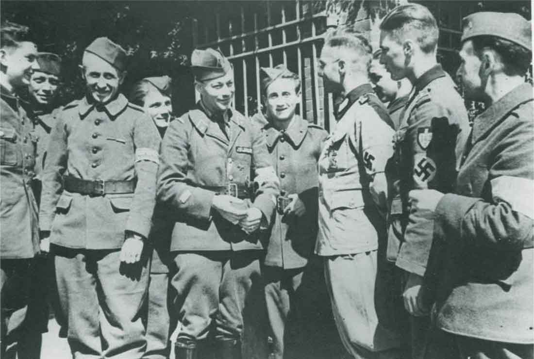 Frenchmen in French uniform speaking with German soldiers one of whom is a - photo 2