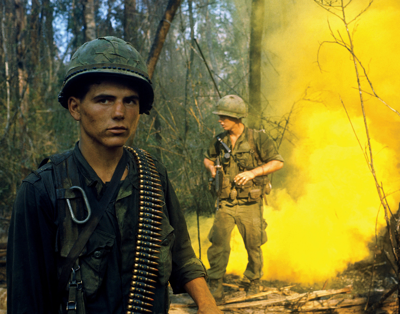 Still blanketed in yellow smoke laid down to mark their position so that a US - photo 4